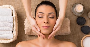 Beautiful Latin Woman Getting Facial Massage At Spa